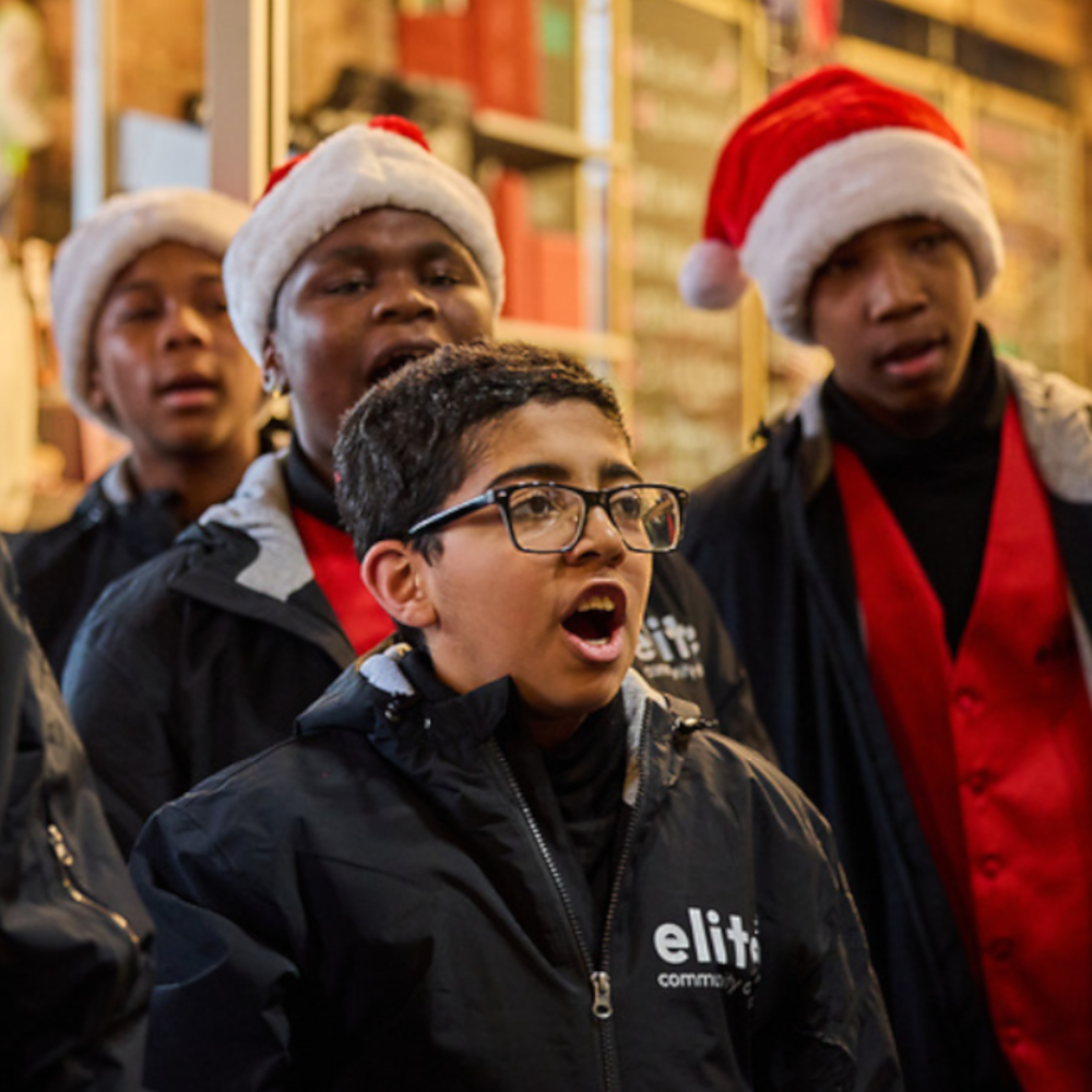 The Elite Christmas Choir performs at the Chocolate Turkey race/walk event.