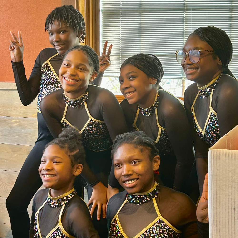 The Elite Community Outreach dance troupe poses for the camera.