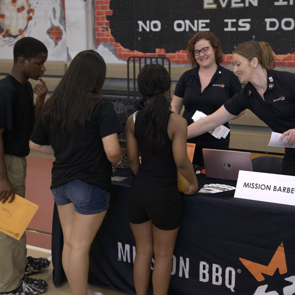 Students meet prospective employers at the Elite Community Outreach job fair.