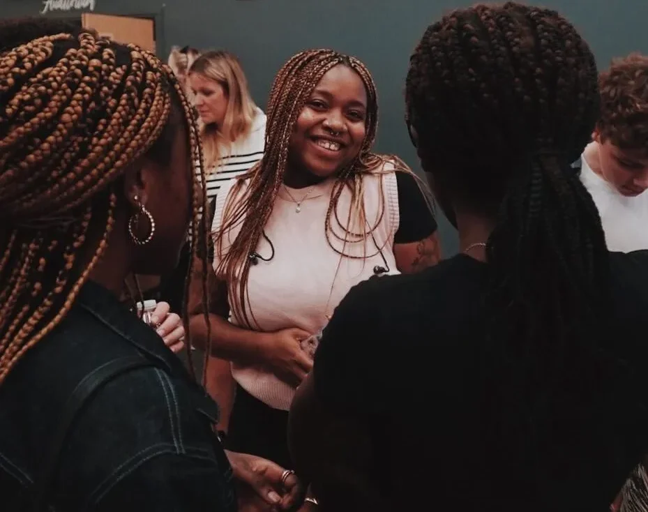 Group of ladies standing around talking